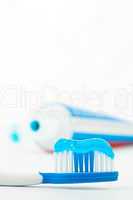 Toothpaste next to a toothbrush