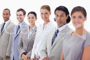 Close-up of business people smiling and looking straight