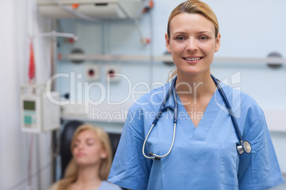 Nurse standing while looking at camera