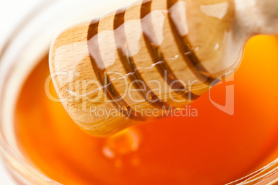 Honey dipper outgoing a honey bowl