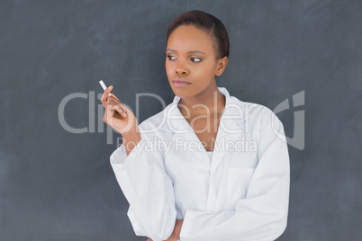 Front view of a teacher holding a chalk