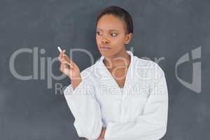 Front view of a teacher holding a chalk