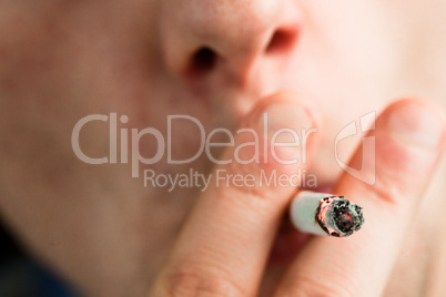 Close up of a man smoking