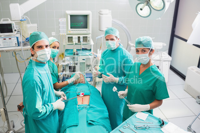 Group of surgeon working on a patient in an operating theater