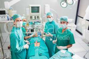 Group of surgeon working on a patient in an operating theater