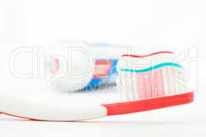Red toothbrush with toothpaste