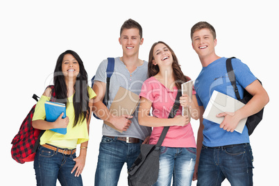 A laughing group of students as they look at the camera