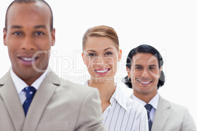 Big close-up of colleagues smiling in a single line