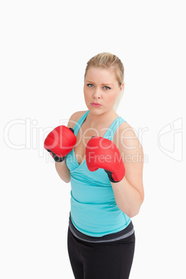 Woman wearing sportswear and gloves