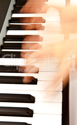 Hands playing piano