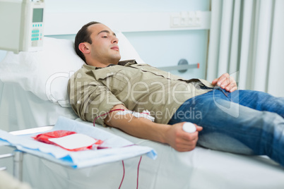 Transfused patient lying on a bed