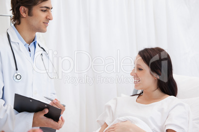 Patient smiling while talking to a doctor