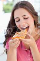 A woman about to eat pizza