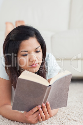 Woman relaxing as she lays on the floor