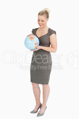 Woman looking at a globe