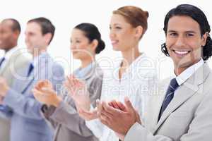 Close-up of a business team smiling and applauding