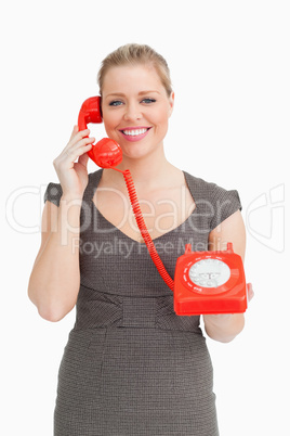 Woman calling with a dial phone