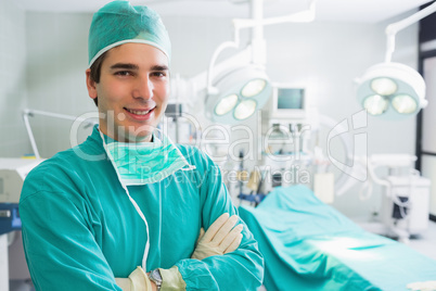 Surgeon smiling with arms crossed