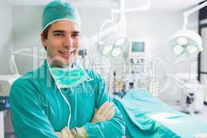 Surgeon smiling with arms crossed