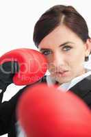 Beautiful woman boxing with red gloves