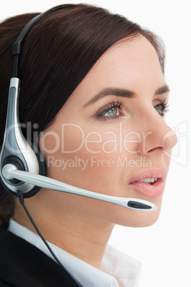 Green eyed businesswoman speaking in a headset