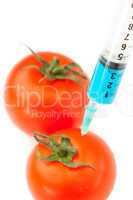 Syringe pricking a tomato