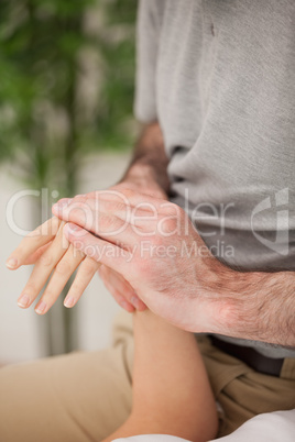 Doctor rubbing the hand of a patient