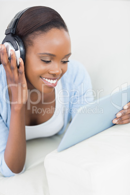 Black woman looking at a tablet computer