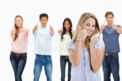 Close-up of people smiling and approving with one young woman in