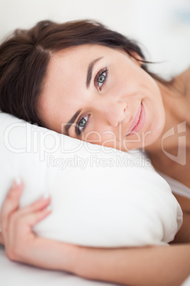Peaceful woman lying in her bed in the morning