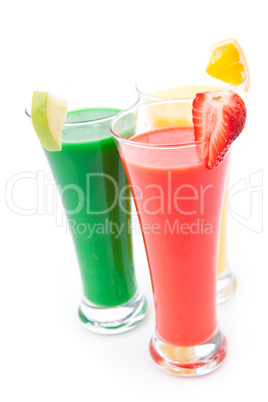 Three full glasses with fruit pieces