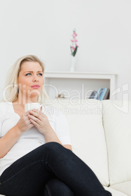 Woman with a cup of coffee in her hands