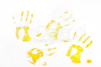 Four yellow handprints