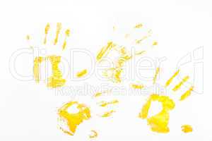 Four yellow handprints