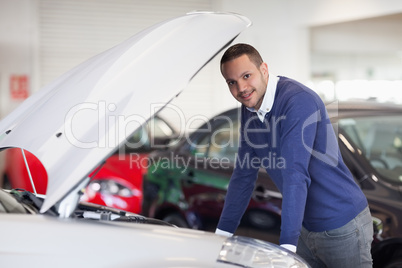 Man leaning over a car