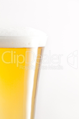 Glass full of beer and foam
