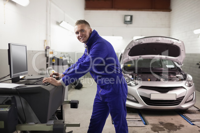 Smiling mechanic using a computer