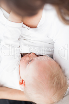 Cute baby being breastfed