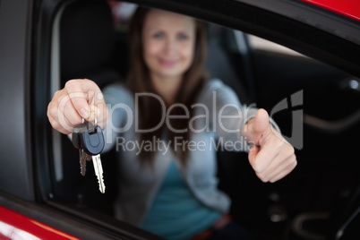 Client sitting in her car while holding car keys