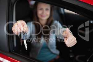 Client sitting in her car while holding car keys