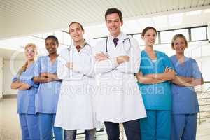 Doctors with nurses with arms crossed