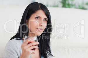 Woman holding a glass full of wine