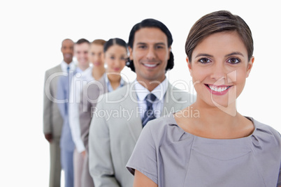 Big close-up of colleagues in a single line smiling and looking