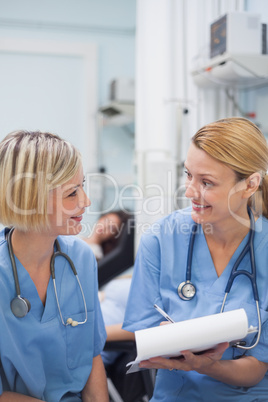 Smiling nurses speaking