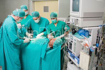 View of a medical team operating a patient