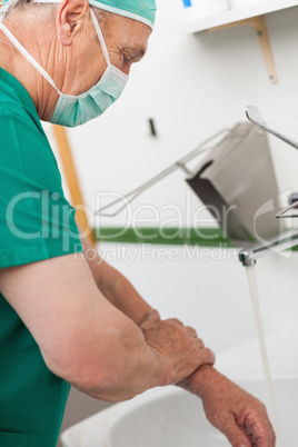 Surgeon washing his hands