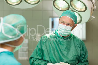 Smiling surgeon looking at a colleague