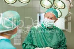 Smiling surgeon looking at a colleague