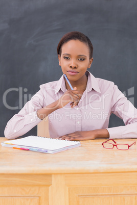 Teacher thinking while looking at camera