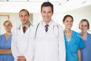 Doctors with nurses looking at camera